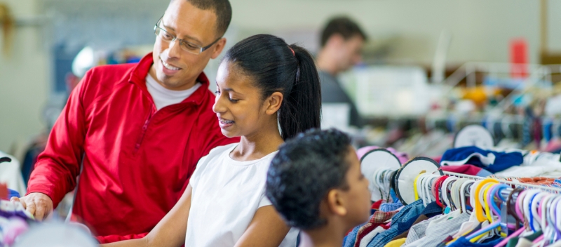 Father and daughter shopping at a nonprofit store that was made possible by vehicle donations